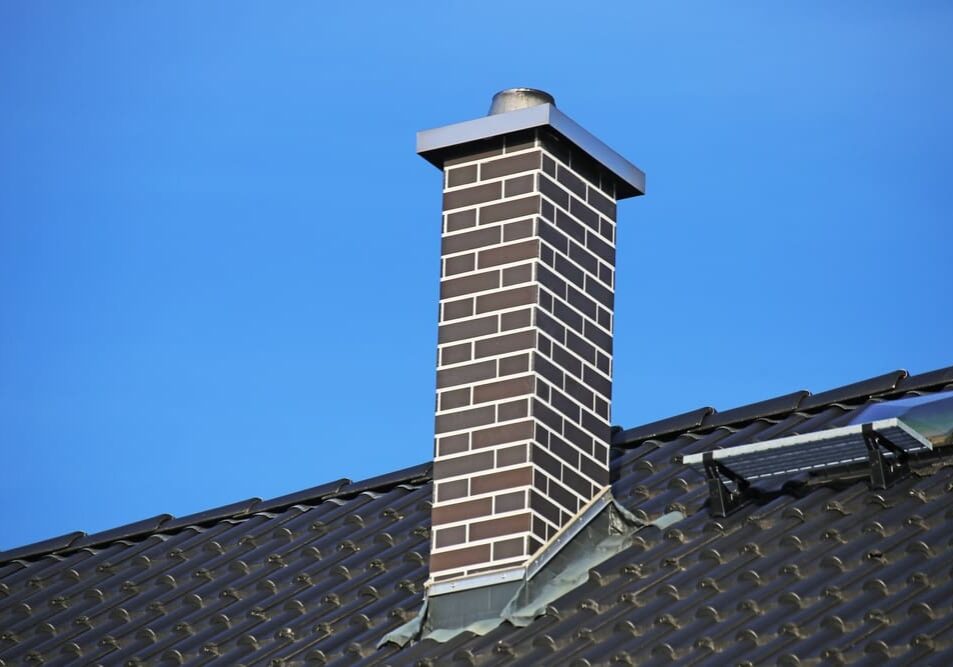 Chimney,Clad,With,Clinker,Bricks,On,A,Newly,Covered,Roof